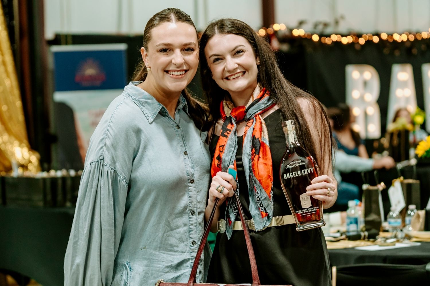 A textured, abstract splash of warm beige paint with soft edges and splatters, set against a transparent background.